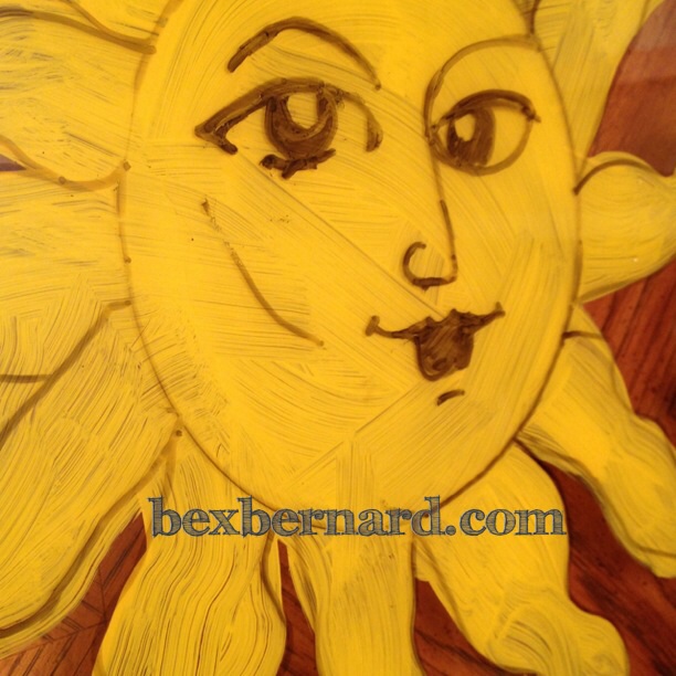 McMenamins sun face painted window frame