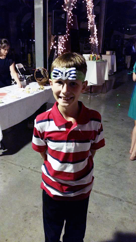 anchor garter on kid's head. boy catches garter. | bexbernard.com
