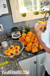 slicing blanched peaches. how to can fresh peaches in a water bath canner with mason jars. canning, food preservation | bexbernard.com