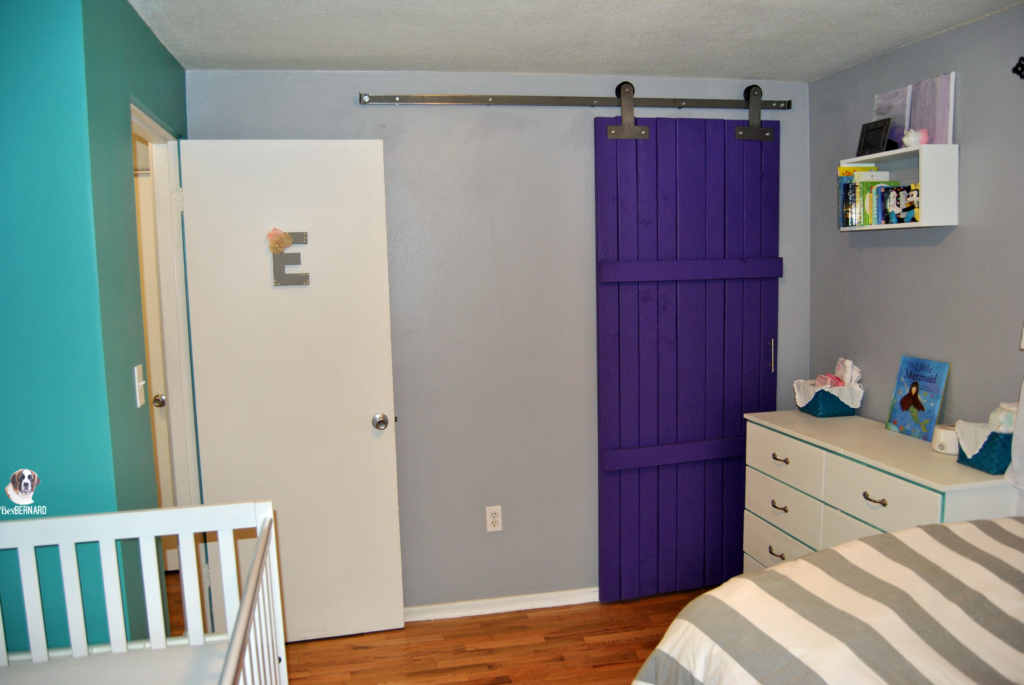 mermaid theme nursery with a purple barn door. sliding barn door for kid's room | bexbernard.com
